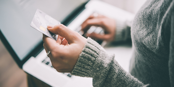 woman holding credit card